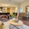 a living room with a dining table and chairs