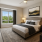 luxurious bedroom with large windows and katy trail views