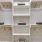 a white shelving unit with objects on it