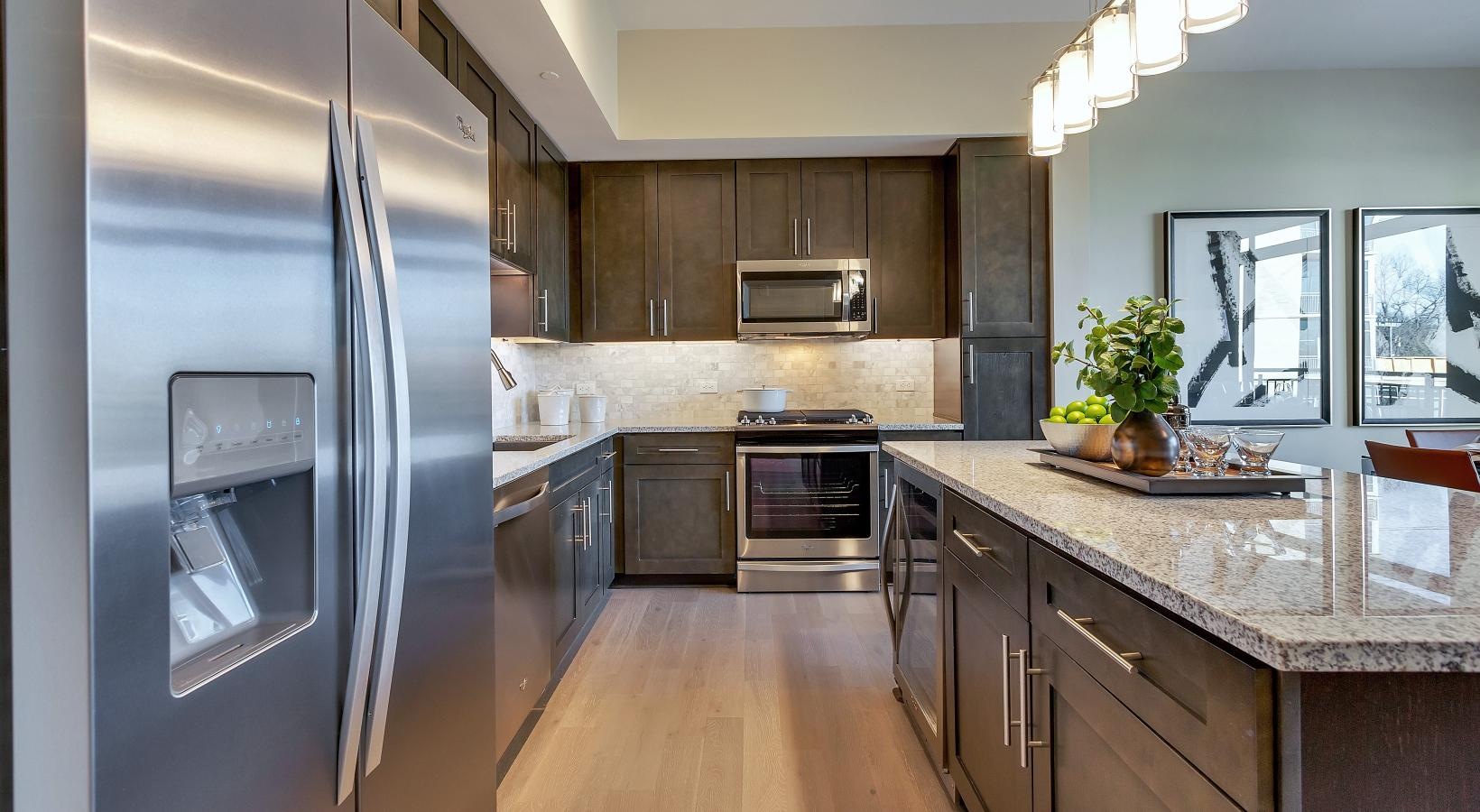 Spacious kitchens with thoughtful details a kitchen with stainless steel appliances