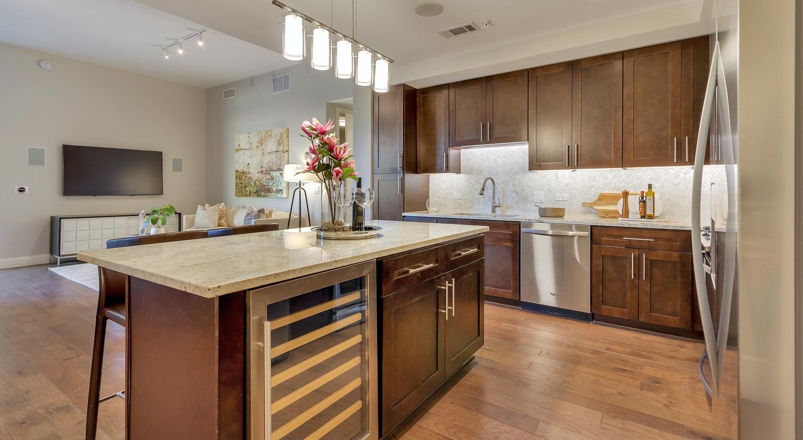Spacious kitchens with thoughtful details a kitchen with a marble island