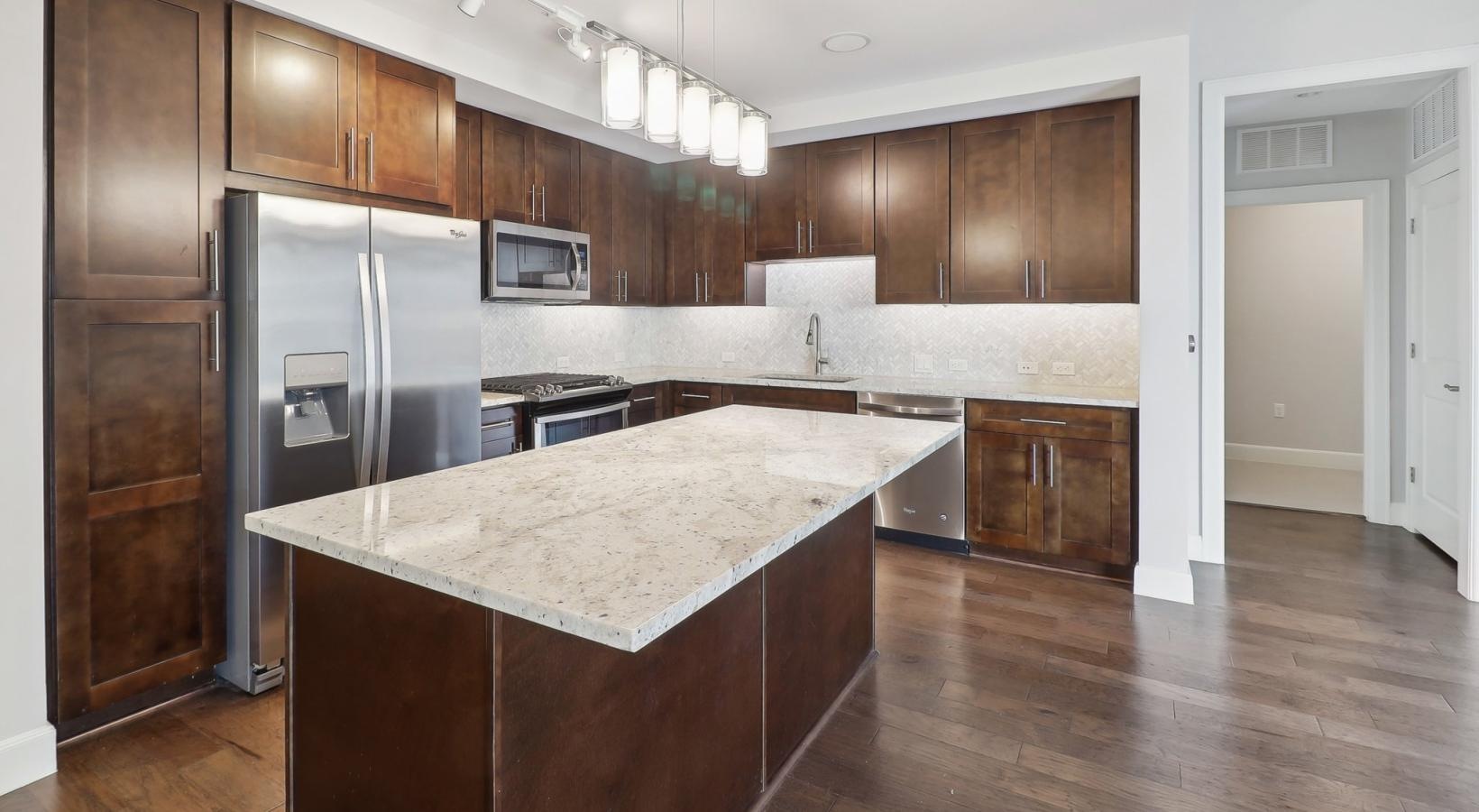 Beautiful kitchens with designer finishes a kitchen with wooden cabinets