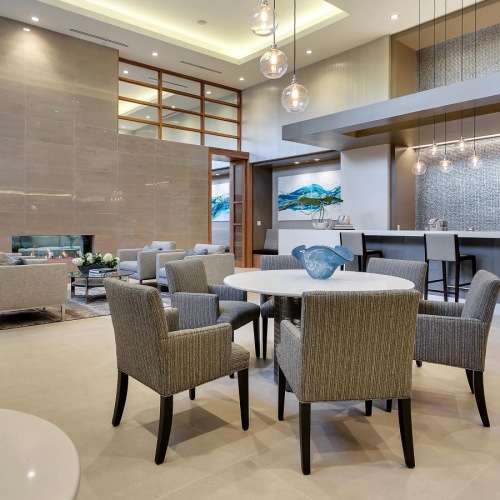 Enjoy our resident-only features a room with a table chairs and a large window