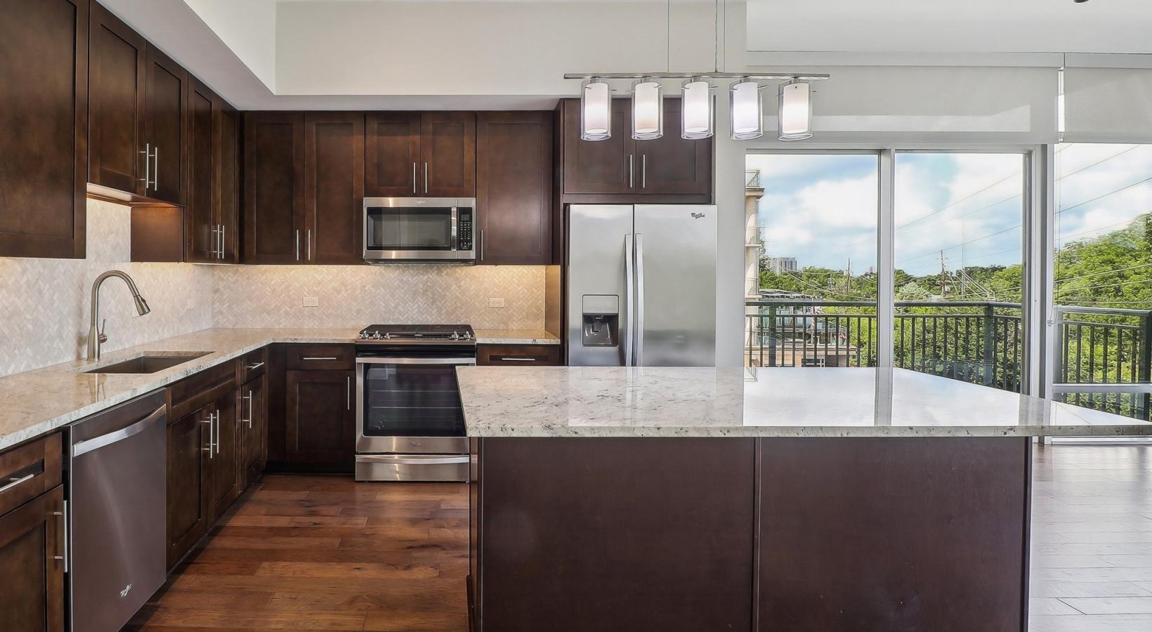 Spacious kitchens with thoughtful details a kitchen with a large window